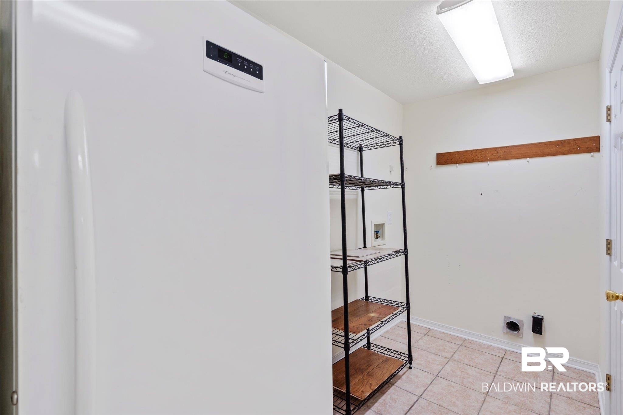 7236 Highpointe Place East Daphne, AL 36527 - Photo 24 of 32 Washroom with washer hookup, light tile patterned floors, electric dryer hookup, and a textured ceiling