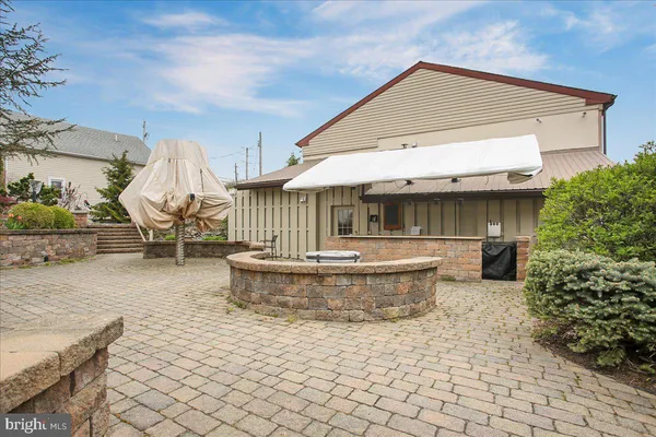 a front view of a house with sitting area