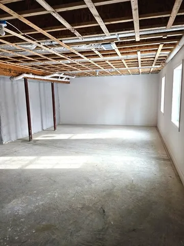 a view of an empty room with windows