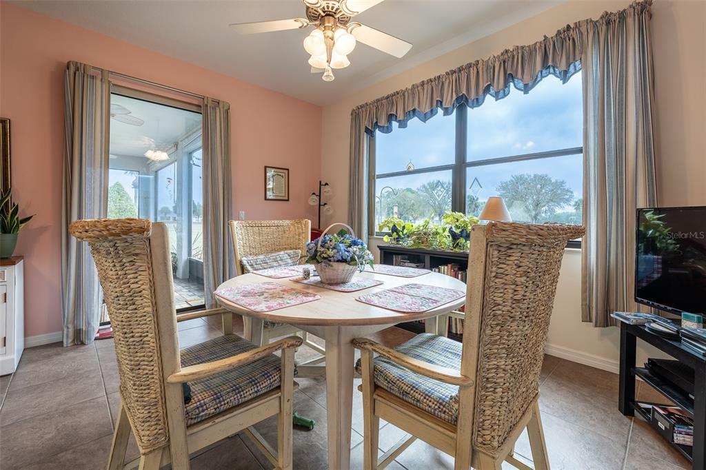 15969 Southwest 14th Avenue Road Ocala, FL 34473 - Photo 13 of 46 a view of a dining room with furniture window and wooden floor