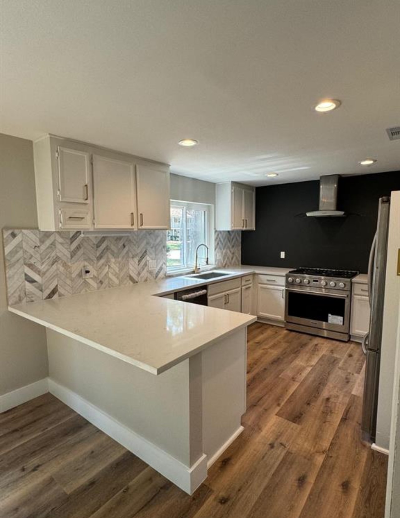 8143 Northbridge Drive Spring, TX 77379 - Photo 6 of 30 a kitchen with stainless steel appliances granite countertop a sink and a stove top oven