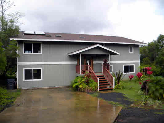6392 Kalama Road, Unit 4 Kapaa, HI 96746 - Photo 1 of 24 a front view of a house with a yard