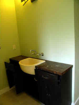 6392 Kalama Road, Unit 4 Kapaa, HI 96746 - Photo 12 of 24 a view of a bathroom with a sink and a vanity