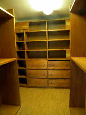 6392 Kalama Road, Unit 4 Kapaa, HI 96746 - Photo 17 of 24 a view of a refrigerator with wooden cabinets