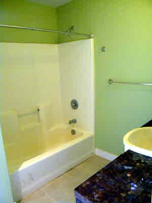 6392 Kalama Road, Unit 4 Kapaa, HI 96746 - Photo 23 of 24 a bathroom with a bathtub and a shower