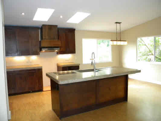 6392 Kalama Road, Unit 4 Kapaa, HI 96746 - Photo 5 of 24 a kitchen with kitchen island granite countertop a sink and a stove