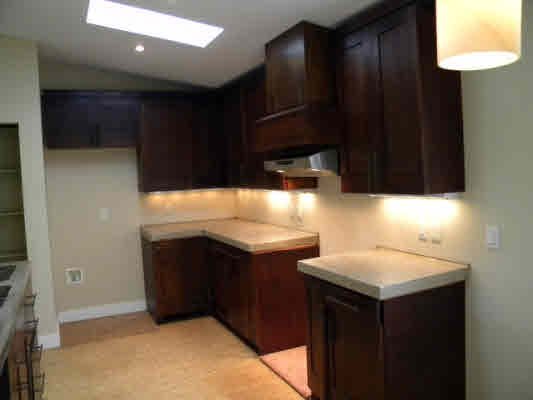 6392 Kalama Road, Unit 4 Kapaa, HI 96746 - Photo 6 of 24 a kitchen with a sink and cabinets