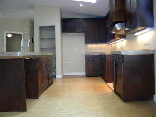 6392 Kalama Road, Unit 4 Kapaa, HI 96746 - Photo 7 of 24 a view of kitchen and hall with wooden floor