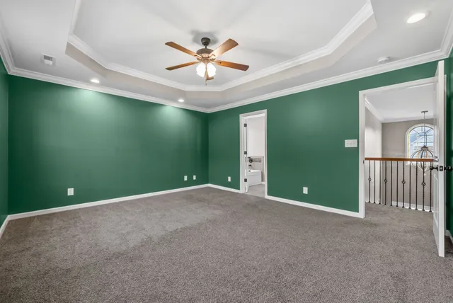 a view of a livingroom with a ceiling fan and window