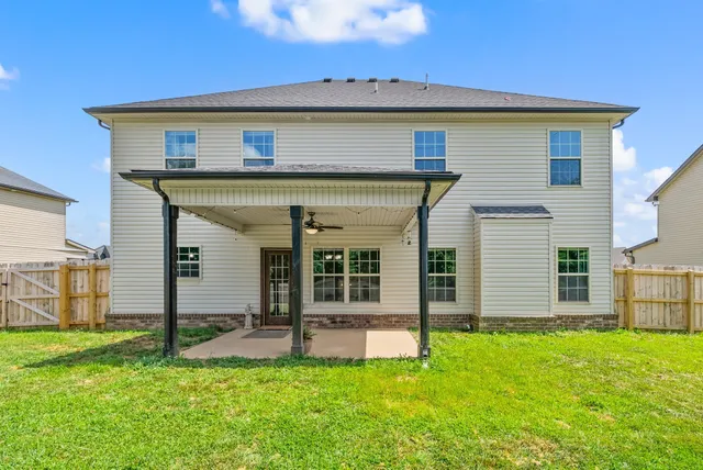 an aerial view of houses with outdoor space