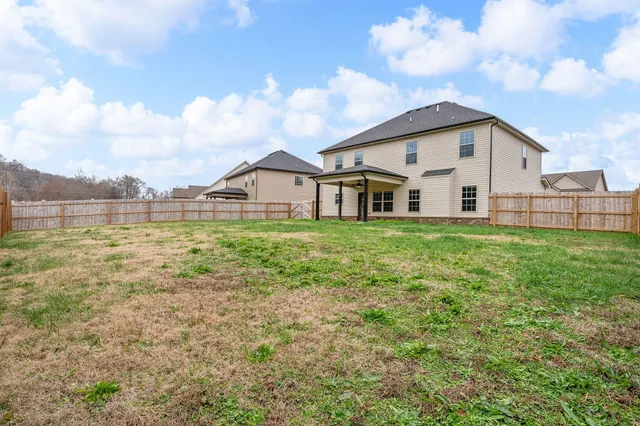 a view of a yard with an outdoor space