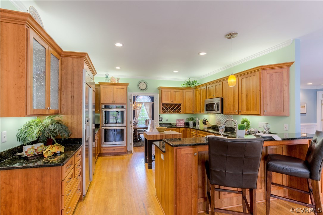 3613 Salles Ridge Court Midlothian, VA 23113 - Photo 11 of 36 a view of a dining room with furniture and chandelier