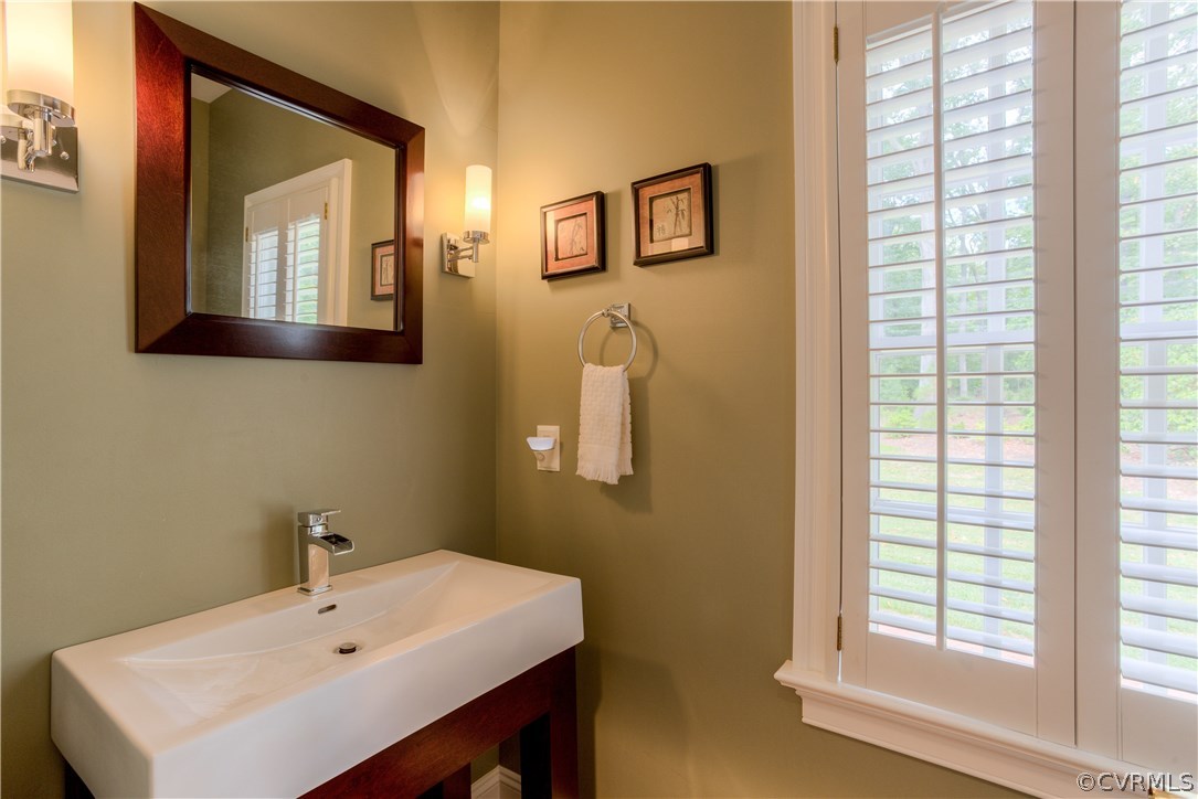 3613 Salles Ridge Court Midlothian, VA 23113 - Photo 14 of 36 a bathroom with a sink a mirror and a window