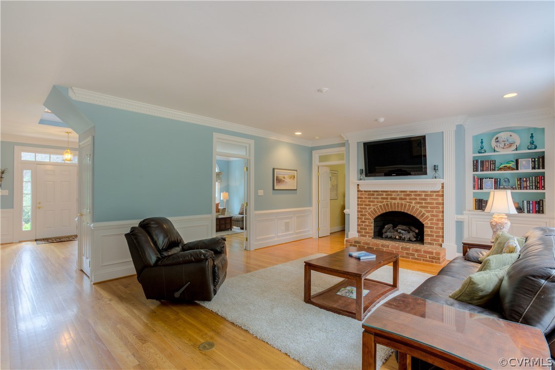 3613 Salles Ridge Court Midlothian, VA 23113 - Photo 16 of 36 a living room with furniture and a fireplace