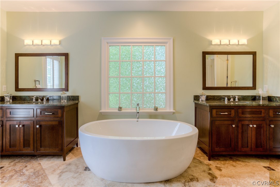 3613 Salles Ridge Court Midlothian, VA 23113 - Photo 24 of 36 a spacious bathroom with a tub sink and mirror