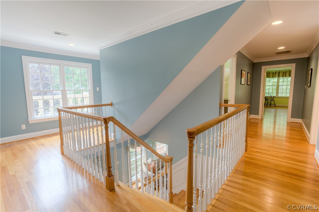 3613 Salles Ridge Court Midlothian, VA 23113 - Photo 29 of 36 a view of a hallway with wooden floor and staircase