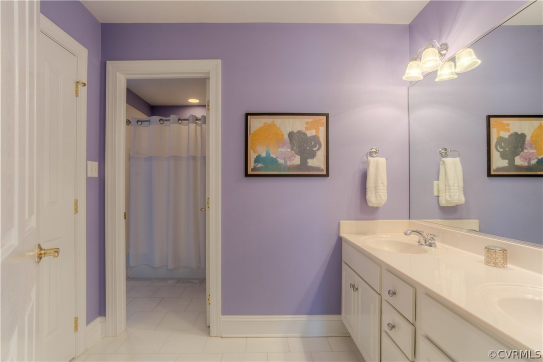 3613 Salles Ridge Court Midlothian, VA 23113 - Photo 31 of 36 a bathroom with a sink vanity and a mirror