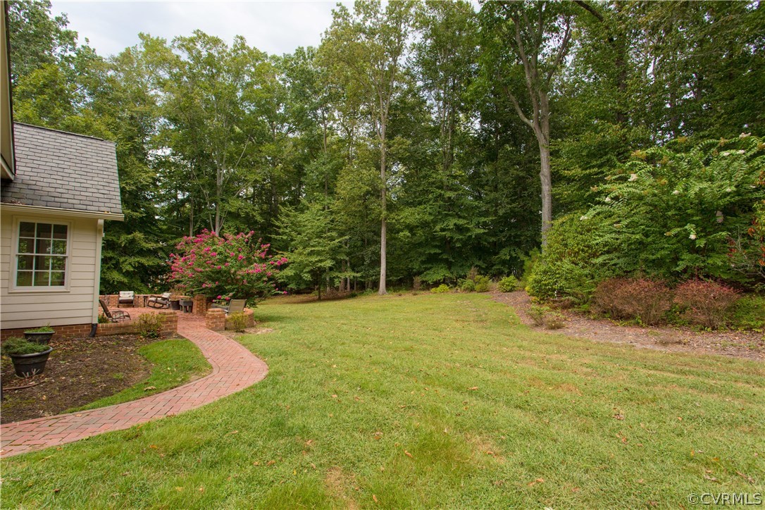 3613 Salles Ridge Court Midlothian, VA 23113 - Photo 34 of 36 a view of a backyard with plants and large trees