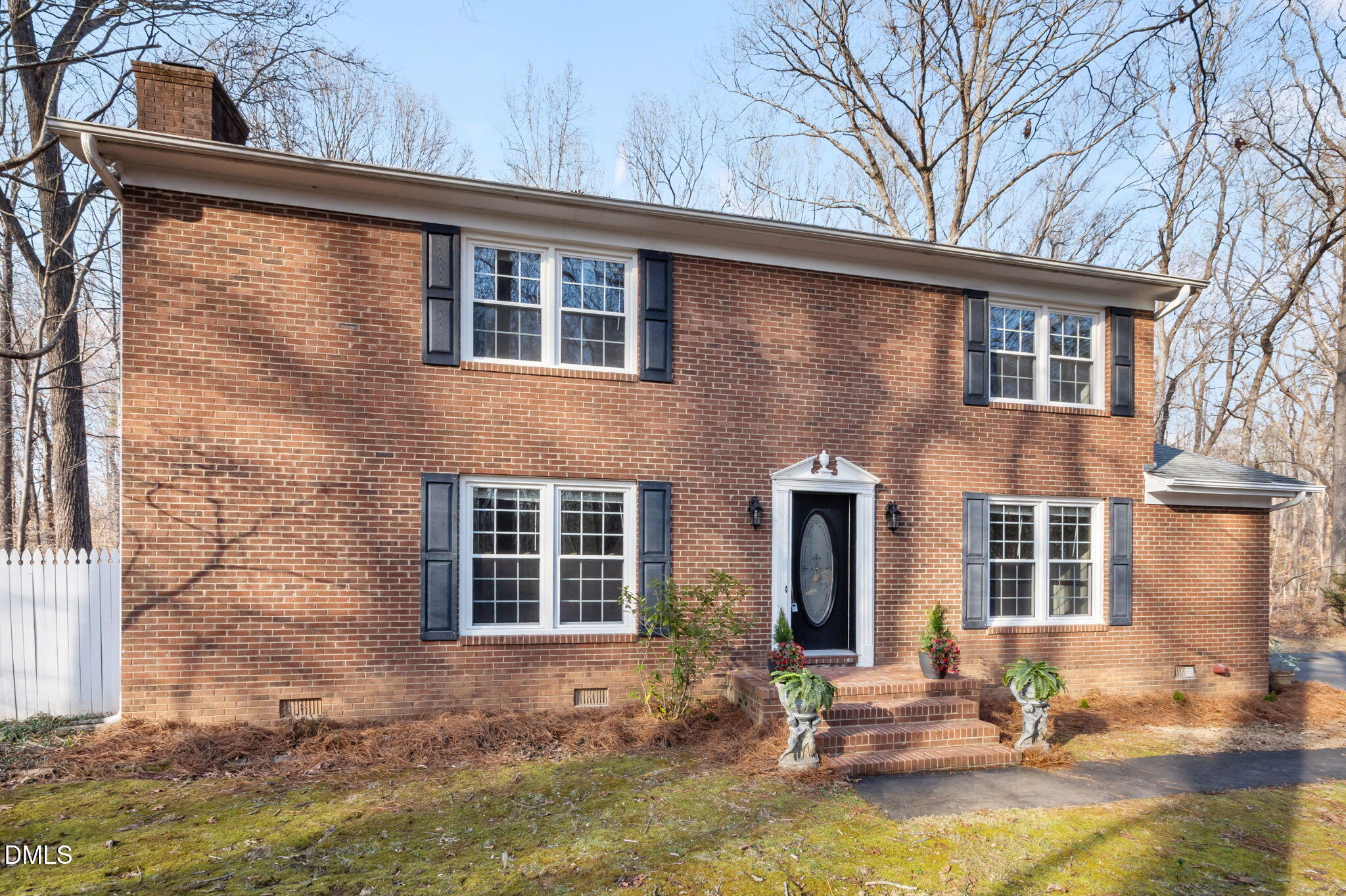 a front view of a house with swimming pool and glass windows