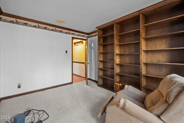 a living room with a furniture and a window