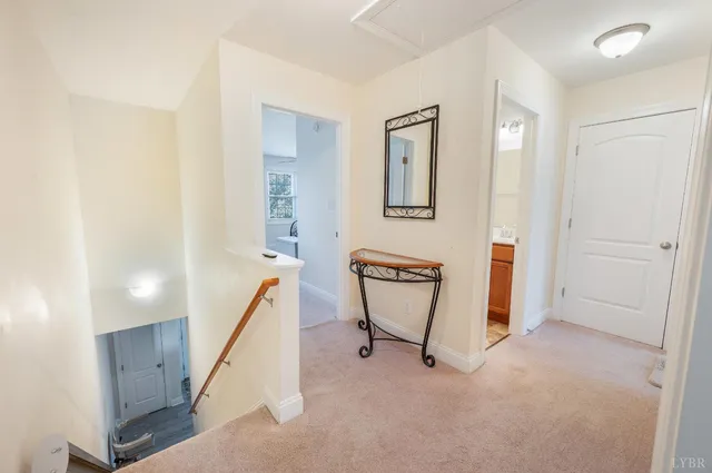 a bedroom with bed and a large window