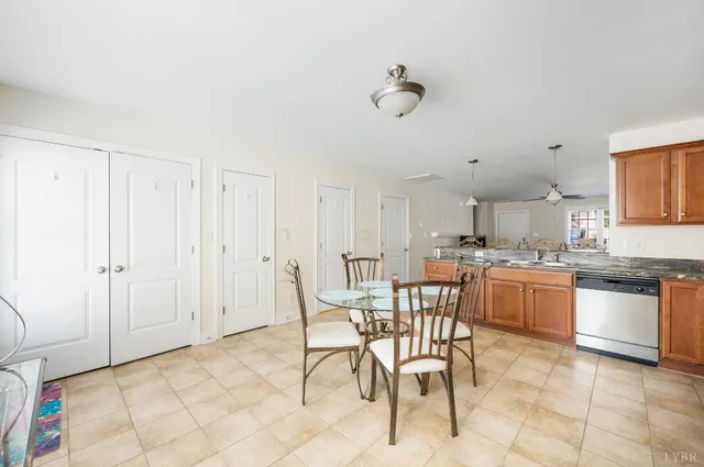 a kitchen with stainless steel appliances granite countertop a sink and cabinets