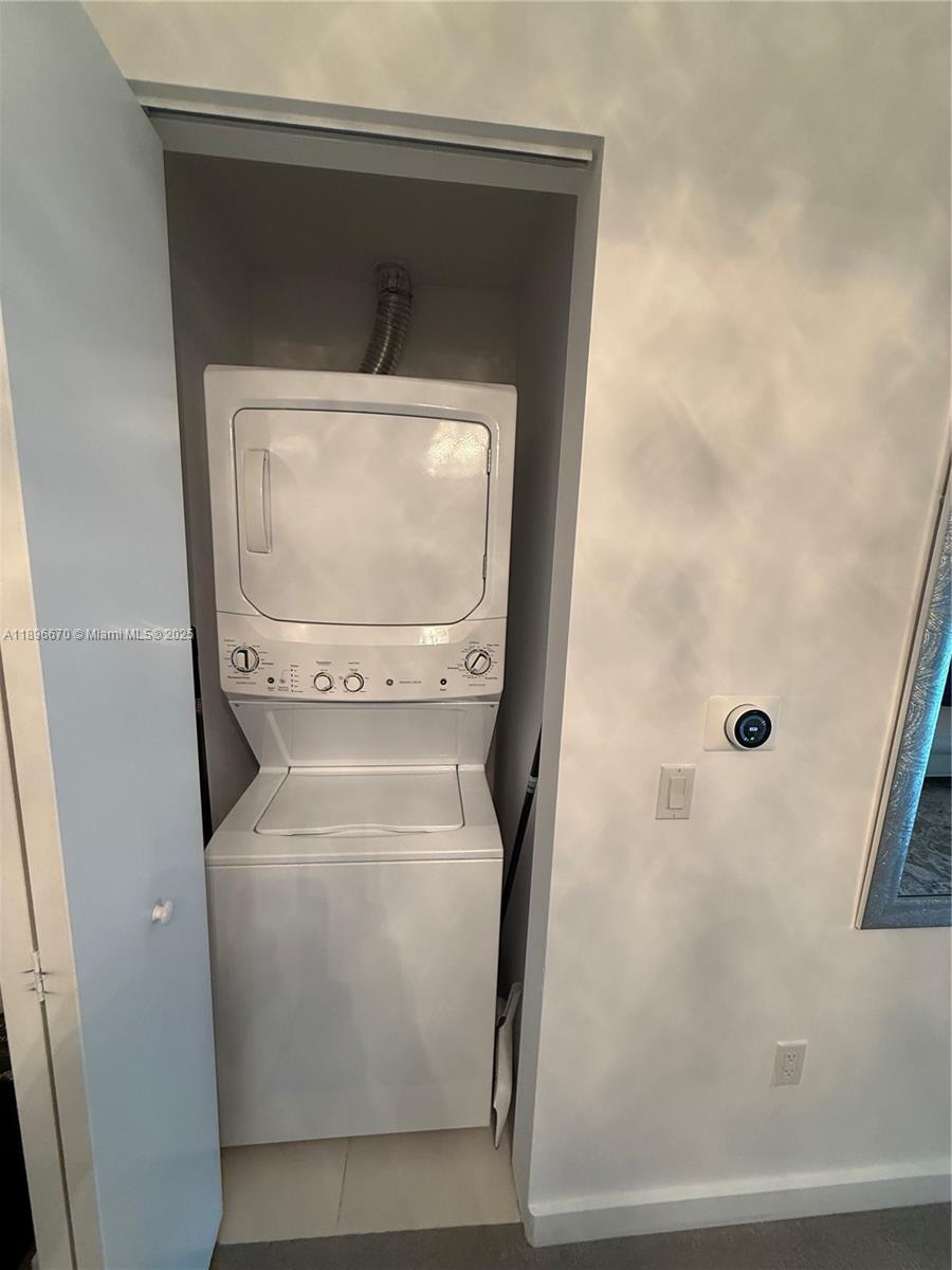 501 Northeast 31st Street, Unit 602 Miami, FL 33137 - Photo 17 of 38 a utility room with a washer and dryer