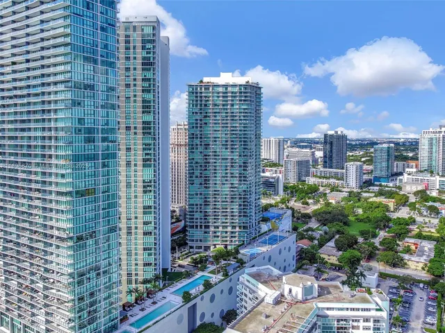 a view of living room with furniture and floor to ceiling window