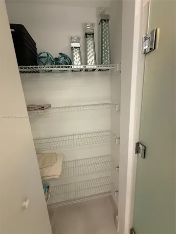 a bathroom with a sink and glass door