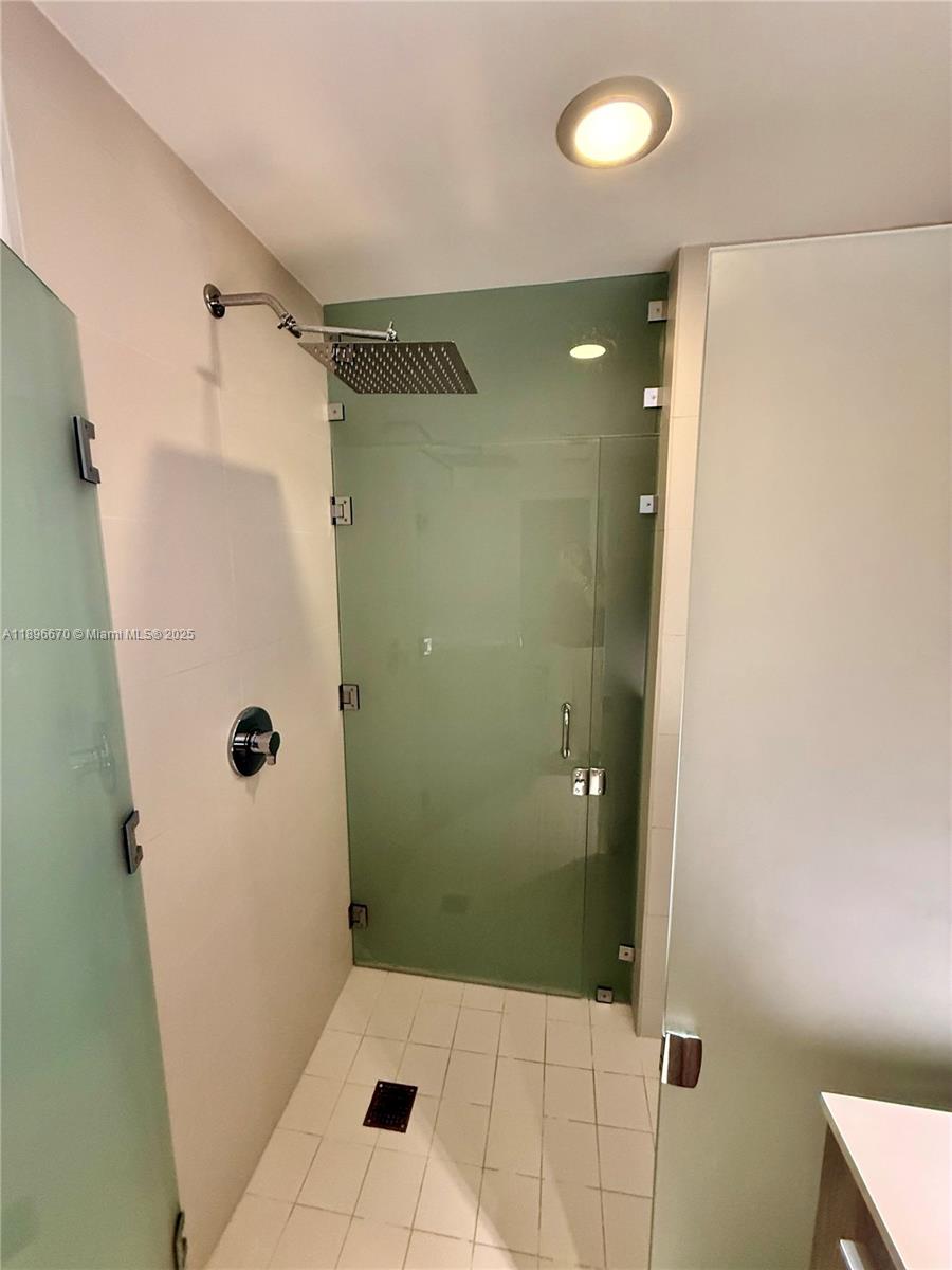 501 Northeast 31st Street, Unit 602 Miami, FL 33137 - Photo 10 of 38 a bathroom with a glass shower door