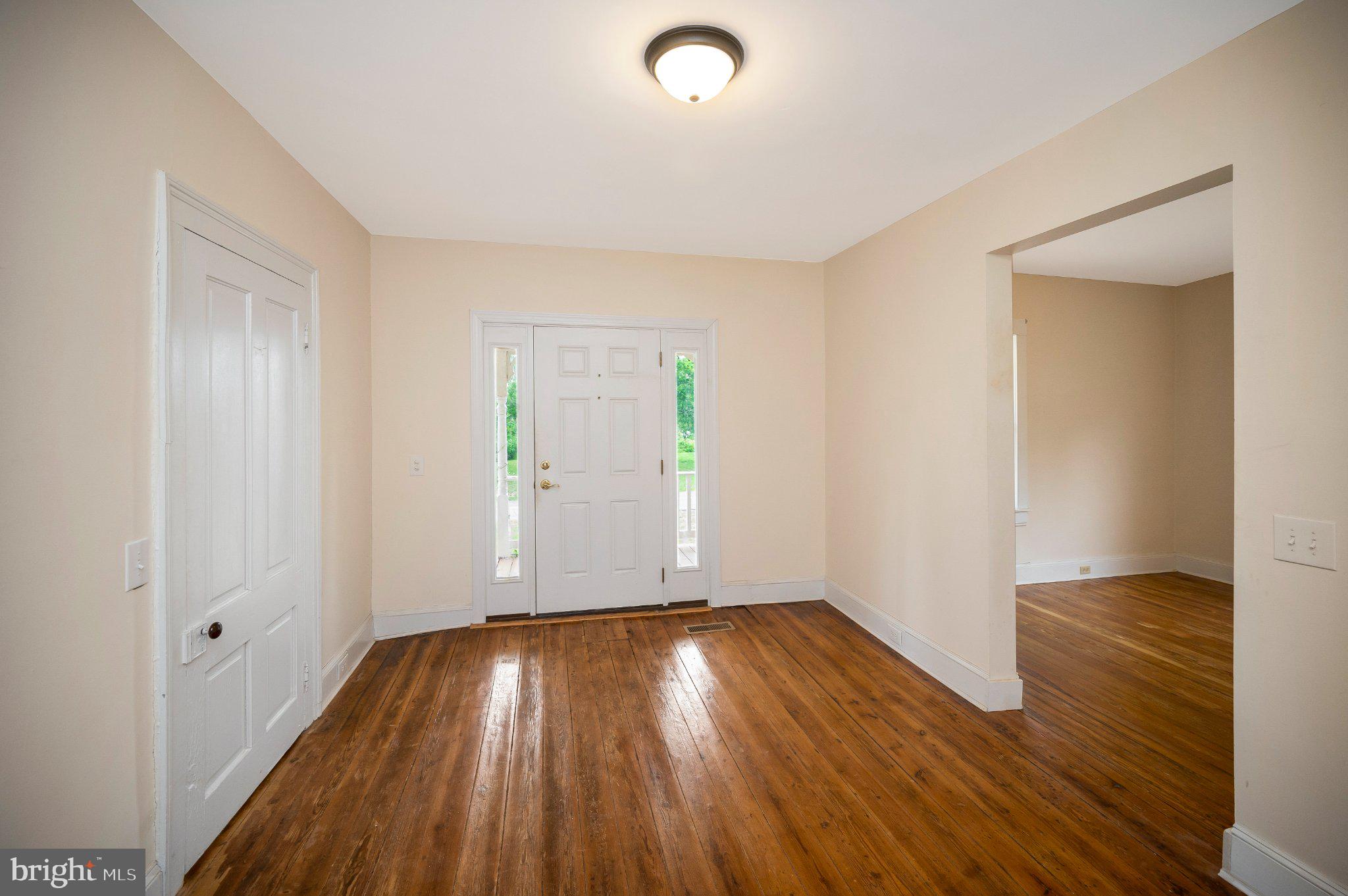 23202 Village Road Unionville, VA 22567 - Photo 8 of 58 wooden floor in an empty room with a window