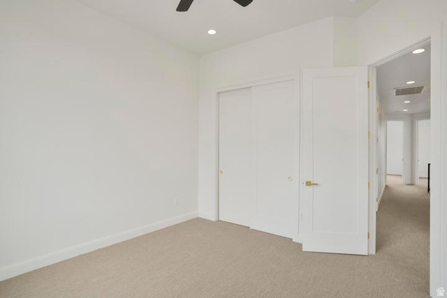990 Manen Street Washington, UT 84780 - Photo 34 of 43 Carpeted interior space featuring white walls and baseboards