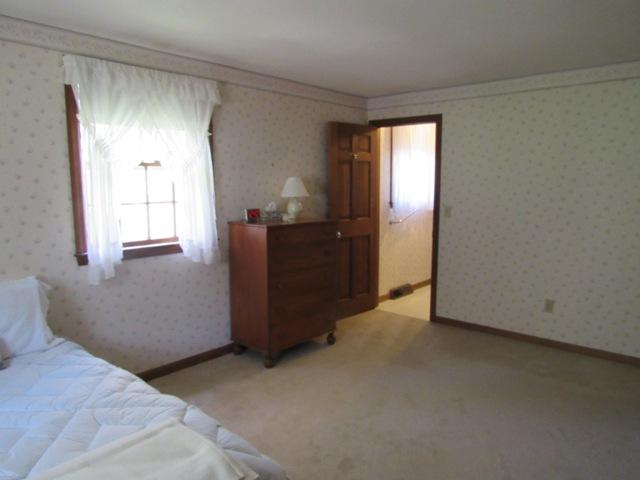 1 Keith Road Pocasset, MA 02559 - Photo 17 of 25 a view of empty room with window and cabinet