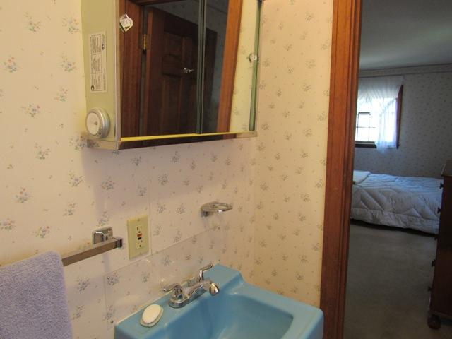 1 Keith Road Pocasset, MA 02559 - Photo 18 of 25 a bathroom with a sink and a mirror