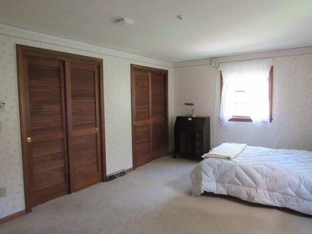 1 Keith Road Pocasset, MA 02559 - Photo 19 of 25 a bedroom with a bed and a closet