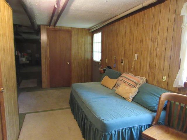 1 Keith Road Pocasset, MA 02559 - Photo 20 of 25 a bedroom with a bed and furniture