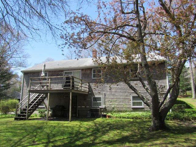 1 Keith Road Pocasset, MA 02559 - Photo 2 of 25 front view of a house with a tree