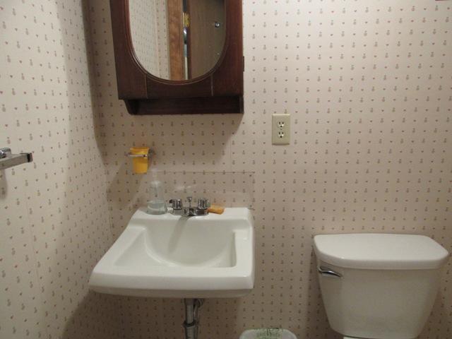 1 Keith Road Pocasset, MA 02559 - Photo 21 of 25 a bathroom with a sink a toilet and mirror