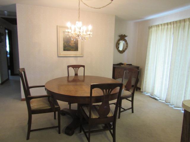 1 Keith Road Pocasset, MA 02559 - Photo 4 of 25 a view of a dining room with furniture and chandelier