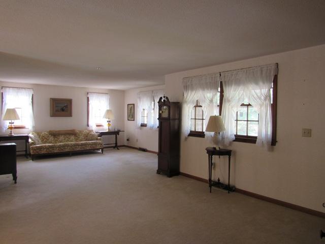 1 Keith Road Pocasset, MA 02559 - Photo 6 of 25 a view of a livingroom with furniture and windows