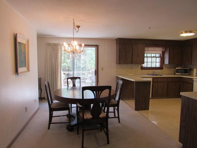 1 Keith Road Pocasset, MA 02559 - Photo 7 of 25 a view of a dining room with furniture and window