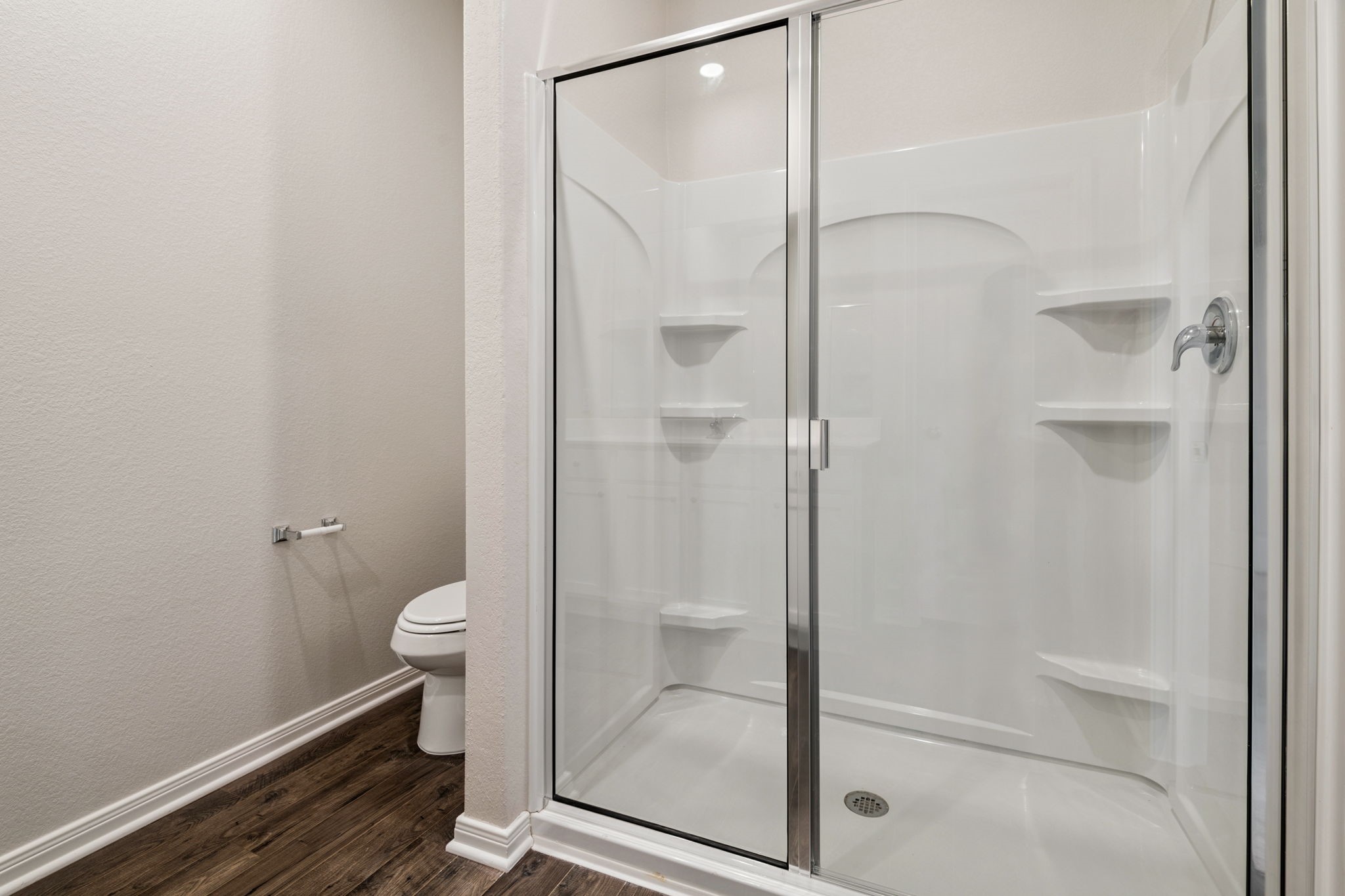 15542 Caramel Spgs Drive Conroe, TX 77303 - Photo 16 of 23 a bathroom with a glass shower door