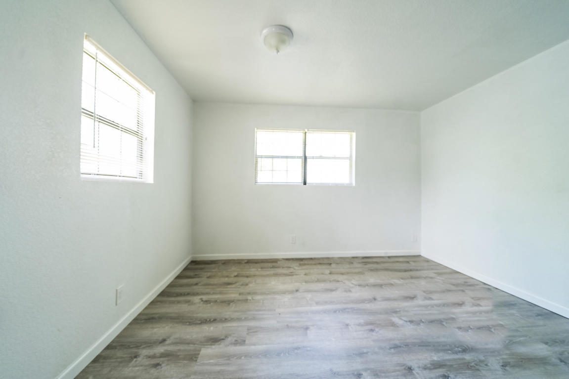 507 Northwest 3rd Street Delray Beach, FL 33444 - Photo 13 of 30 an empty room with wooden floor and windows