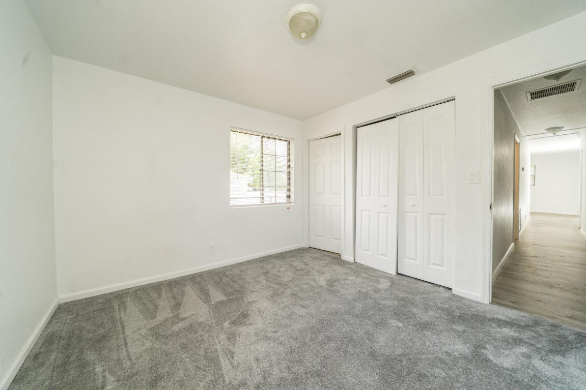 507 Northwest 3rd Street Delray Beach, FL 33444 - Photo 23 of 30 an empty room with windows and closet