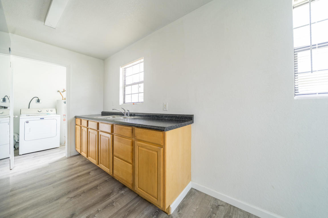 507 Northwest 3rd Street Delray Beach, FL 33444 - Photo 10 of 30 a spacious bathroom with a granite countertop sink and a bathtub