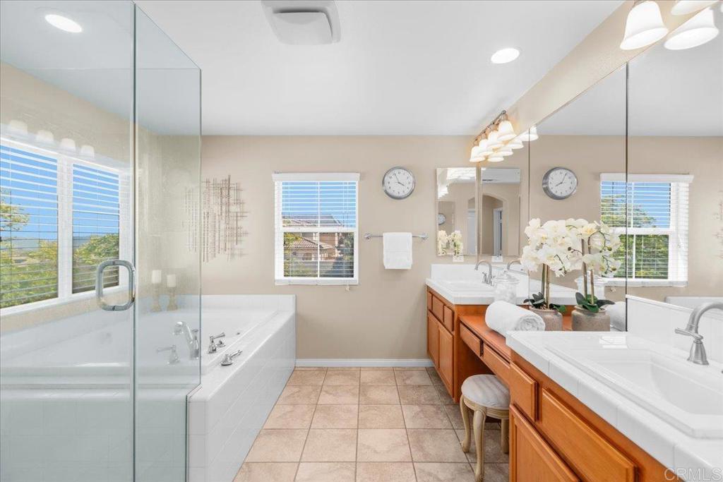 838 Luminara Way San Marcos, CA 92078 - Photo 36 of 54 a bathroom with a tub sink and mirror