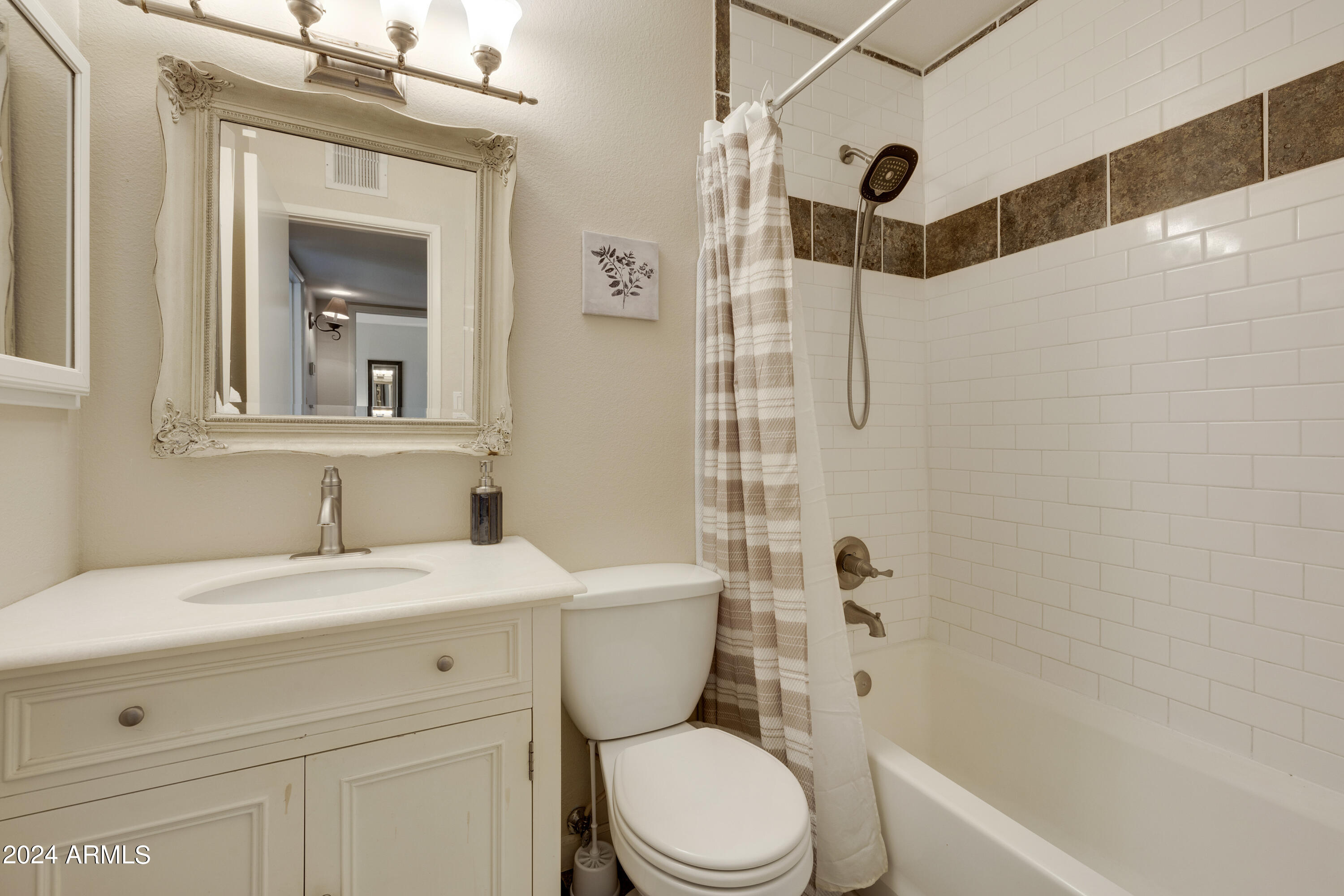 1223 North Granite Reef Road Scottsdale, AZ 85257 - Photo 16 of 35 a bathroom with a sink a toilet and shower