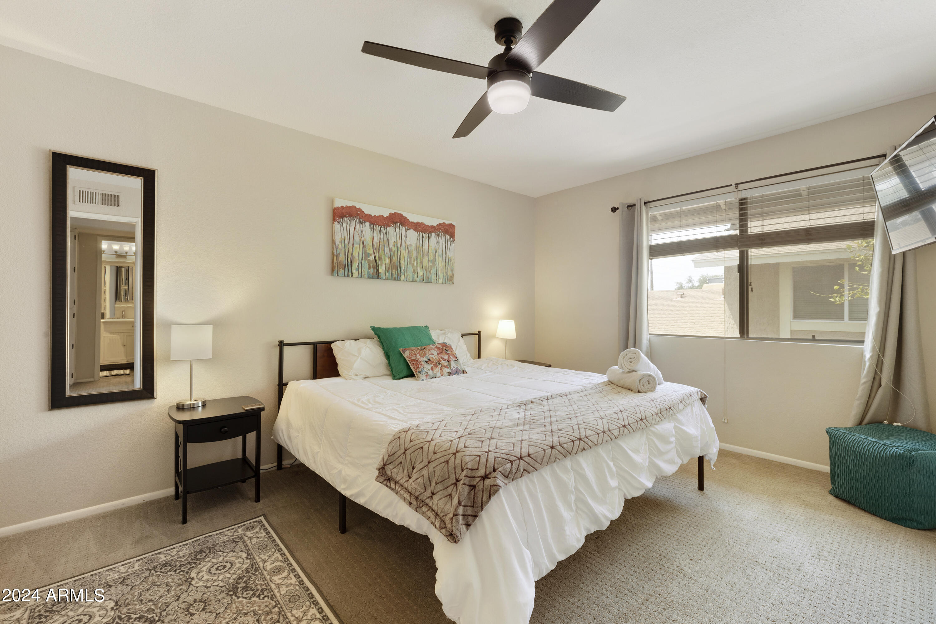 1223 North Granite Reef Road Scottsdale, AZ 85257 - Photo 18 of 35 a bedroom with a bed wooden floor and window
