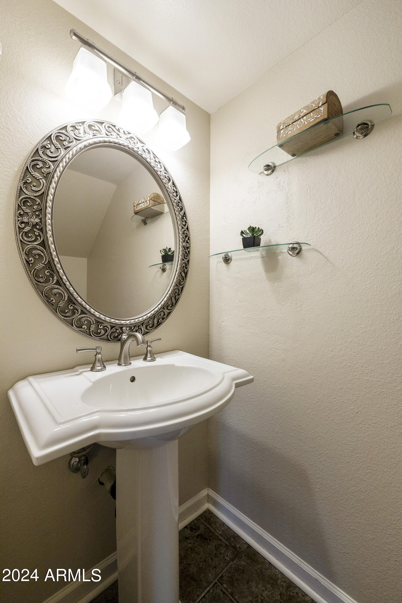 1223 North Granite Reef Road Scottsdale, AZ 85257 - Photo 26 of 35 a bathroom with a sink and mirror