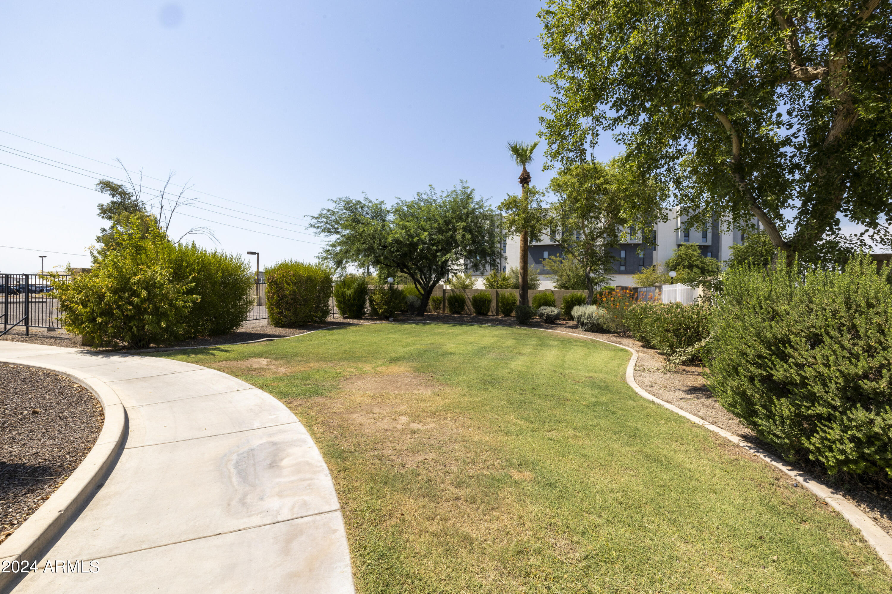 1223 North Granite Reef Road Scottsdale, AZ 85257 - Photo 31 of 35 a swimming pool with trees in the background
